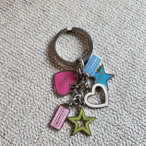 Coach bag charm keychain with enamel over silver tone stars, hearts and mini tag